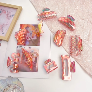 Pink checkered acetate hair claw clips in various geometric shapes for women
