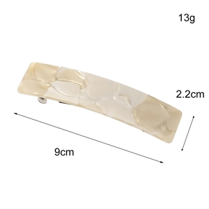 Elegant rectangular acetate hair clip with marble texture and silver metal spring