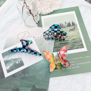 Three-piece checkered hair claw clips set including butterfly and geometric shapes