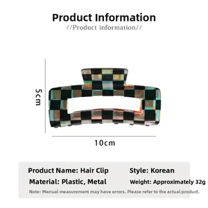 Detail view of checkered claw clip showing 10cm by 5cm dimensions and pattern