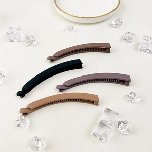 Detailed view of matte banana clips with non-slip teeth in multiple Morandi colors