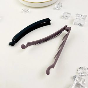 Matte finish banana hair clips set in black and purple with interlocking teeth grip