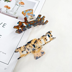 Set of two large acetate hair claws in marble blue and tortoiseshell patterns