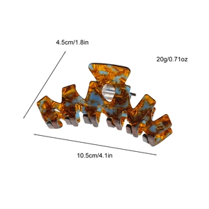 Large acetate hair claw clip with geometric tortoiseshell pattern and 10.5cm size details