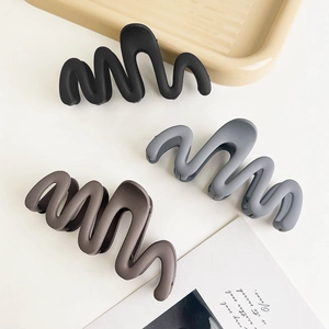 Three-color set of matte wavy hair claw clips in black, grey, and coffee colors