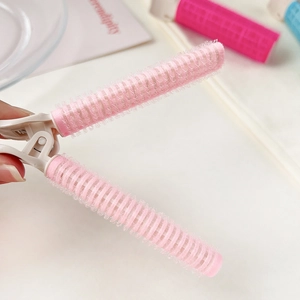 Pink self-grip hair root clip for volumizing bangs and creating natural hair lift