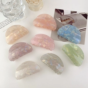 Detailed set of 8 acrylic hair claws in pearlescent pastel shades and marble textures