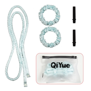 Detailed set of blue heatless hair curler with satin scrunchies, clips and storage bag