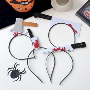 Detail of four Halloween weapon headbands with fake blood splatters on a white background