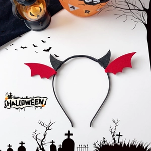 Detail view of Halloween devil headband with black horns and red felt bat wings for parties