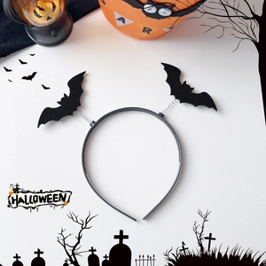 Detail of Halloween headband with bouncing felt bats on springs over white background