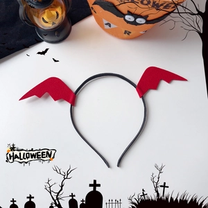 Halloween headband with red bat wings displayed with festive pumpkin lights decoration