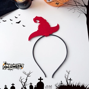 Detail of red felt wizard hat headband with black Halloween silhouette background