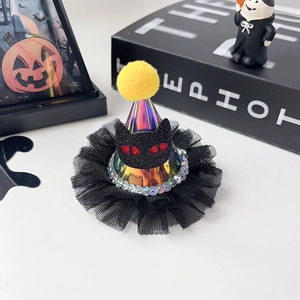 Detail of Halloween hair clip featuring a colorful laser cone hat and black cat felt patch
