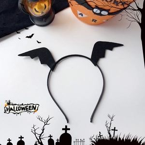 Close-up of black felt bat wing headband for Halloween party hair styling and costumes