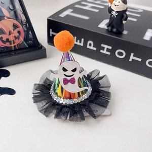 Detail of Halloween hair clip with ghost decor and iridescent cone hat on dark background