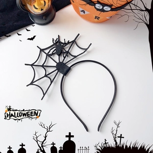 Halloween headband featuring a black spider and web design with spooky festive props