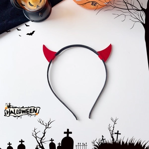 Detail of red devil horns headband for Halloween party with festive background decor
