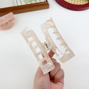Elegant cream marble acrylic hair claw clip for women in a large geometric rectangle shape