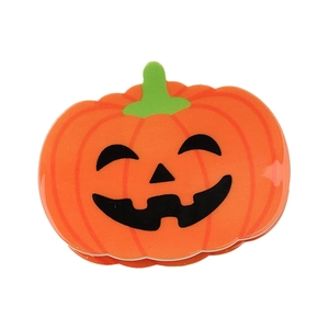 Pince à cheveux citrouille d'Halloween orange avec sourire classique sur fond blanc