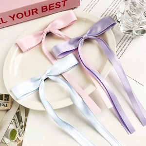 Three-piece satin ribbon bow hair clips set in pink, light purple, and blue colors