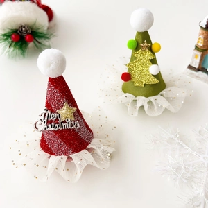 Detailed view of red glitter and green felt mini Christmas hat hair clips with lace trim