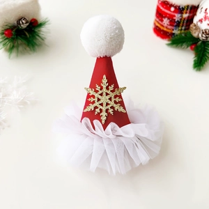 Close-up of a festive Christmas mini hat hair clip with glitter snowflake and white mesh