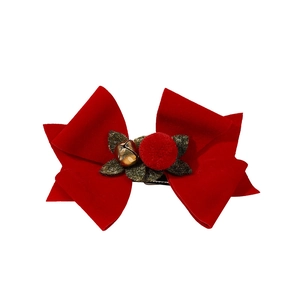 Christmas hair clip with red velvet bow, green leaves and a small golden bell