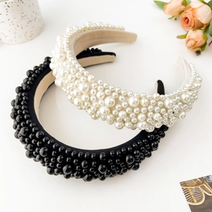 Detail of baroque padded headbands with hand-sewn faux pearls in black and ivory