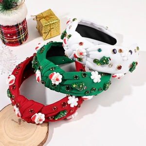 Détail de serre-têtes de Noël à nœuds avec des strass festifs et des motifs de fête