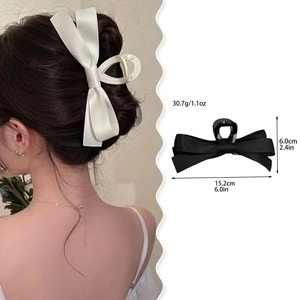 Grande pince à cheveux à double nœud en satin pour femme en noir et blanc