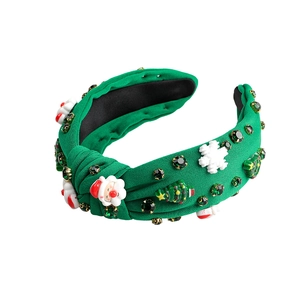 Serre-tête de Noël large avec décors Père Noël et strass verts brillants sur fond vert