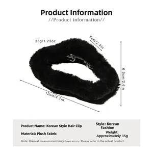 Detail view of large black plush cloud hair claw clip with size measurements 12cm