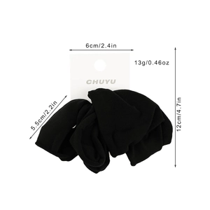 Set of 4 soft wide black fabric hair ties with high elasticity on a display card