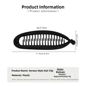Detailed view of black plastic hair clip with dimensions 11.5cm length and matte finish
