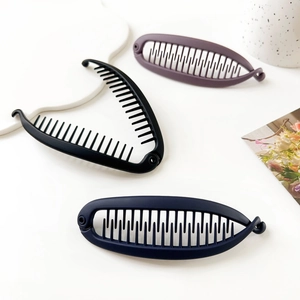 Matte banana hair clips in black, navy, and purple colors for elegant hairstyling