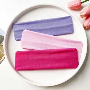 Three-piece set of elastic knitted yoga headbands in purple, pink and rose red