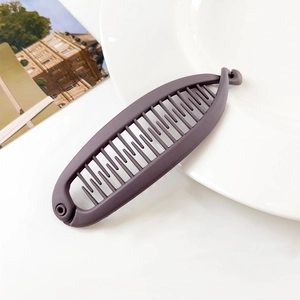 Detailed view of mocha brown banana hair clip with matte texture and sturdy interlocking teeth