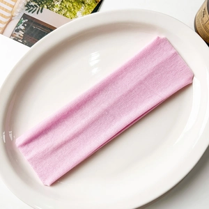 Detailed macro view of the elastic ribbed knit texture on the pink yoga headband