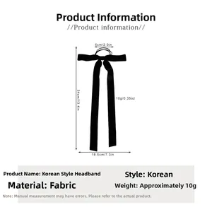 Detailed size chart of a black velvet bow hair tie showing 34cm length and 18.5cm width