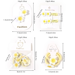 Romantic Y2K plumeria hair clips and ties set in white and yellow resin finish