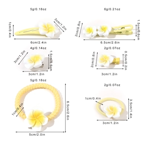 Detailed size chart for white and yellow gradient Plumeria flower hair clips and elastics