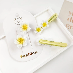 Romantic Y2K plumeria flower hair clips set with white petals and yellow centers