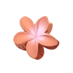 Matte plumeria flower hair claw clip with orange-pink gradient for elegant updos
