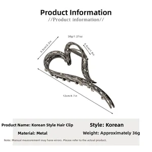 Close-up of heart-shaped liquid metal hair claw clip with size dimensions 12cm by 5.5cm