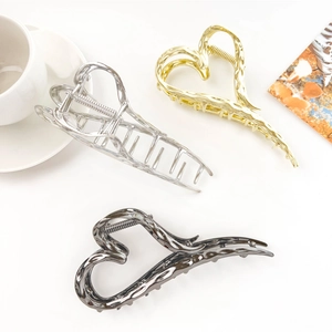Three metallic liquid hollow heart hair claws in silver, gold and black finish