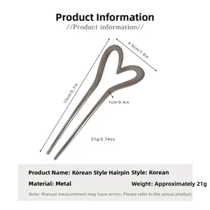 Detail view of the metal heart hair fork with size dimensions 13cm length and 4.5cm width