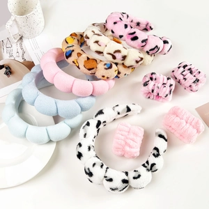 Detail of plush microfiber spa headband and wristband set in various pastel colors