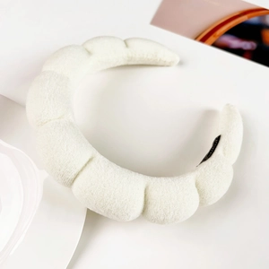 Detailed view of the thick white plush bubble headband showing soft flannel cloud structure