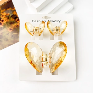 Three-piece set of amber yellow butterfly hair claws with diamond-cut acrylic texture